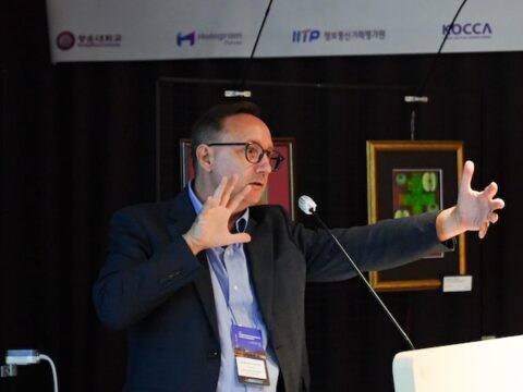 Alaric Hamacher speaking at Holography Forum ISDH
